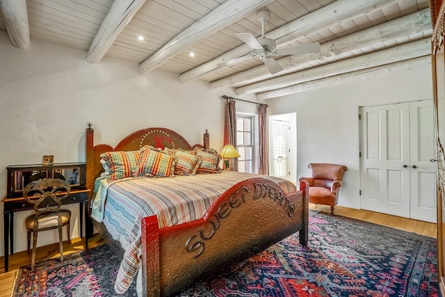 bedroom with wood-type flooring, ceiling fan, beam ceiling, and wooden ceiling