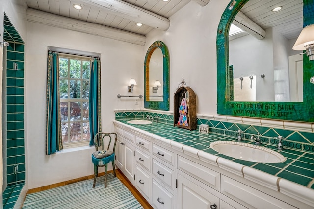 bathroom featuring beamed ceiling, wood ceiling, double sink vanity, and wood-type flooring