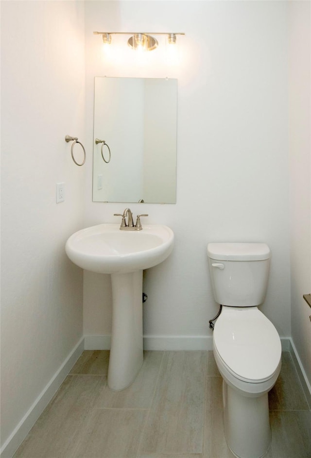 bathroom featuring toilet and sink