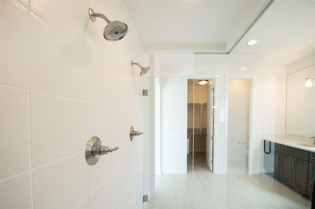 bathroom with a shower and vanity