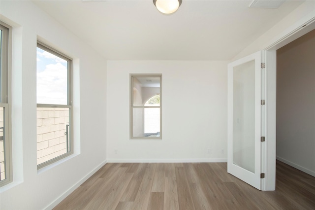 spare room featuring light wood-type flooring