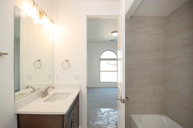 bathroom with tile patterned flooring and vanity