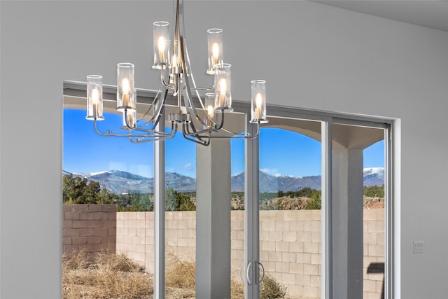 interior details with a mountain view and a notable chandelier