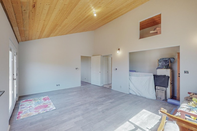 interior space with hardwood / wood-style floors, wooden ceiling, and high vaulted ceiling