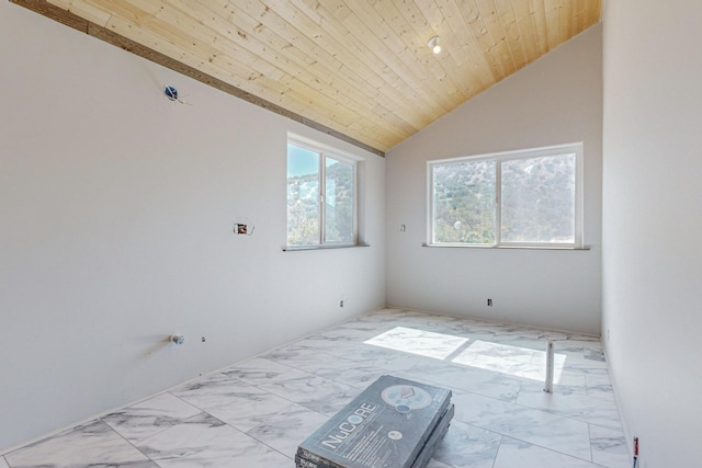 spare room with vaulted ceiling and wood ceiling