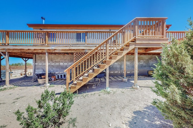 rear view of house with a wooden deck