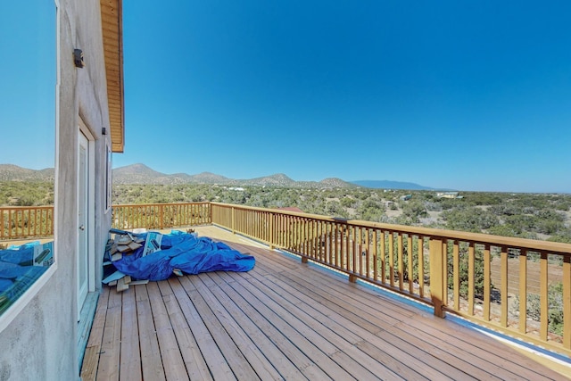 wooden terrace featuring a mountain view