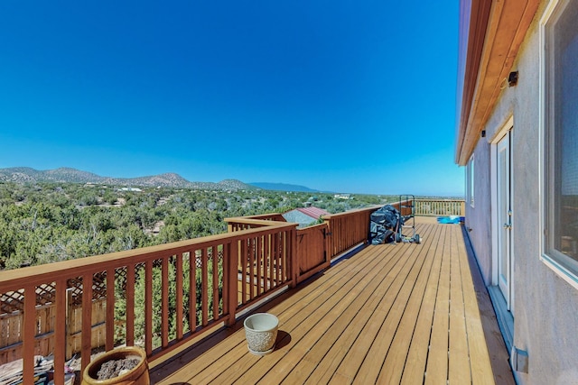 wooden terrace featuring a mountain view