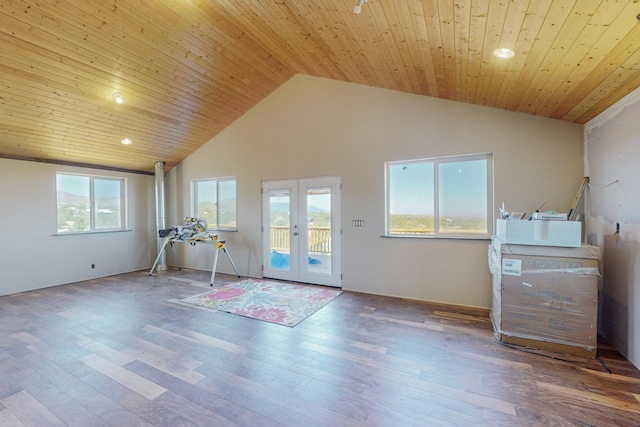 exercise area featuring hardwood / wood-style floors, wood ceiling, high vaulted ceiling, and french doors