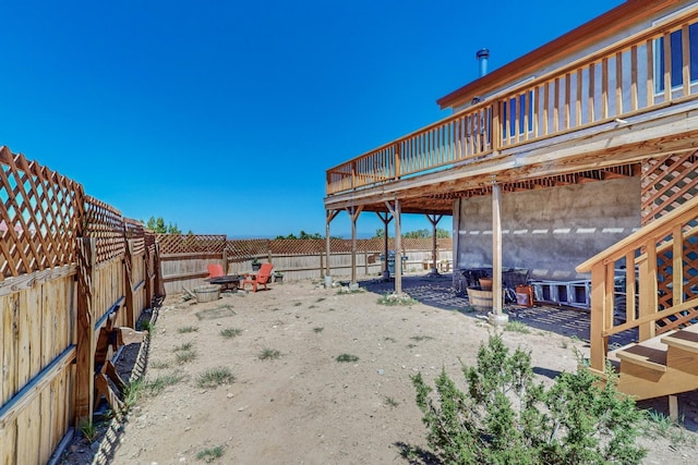 view of yard with a wooden deck