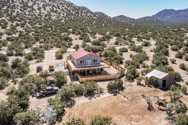 birds eye view of property with a mountain view