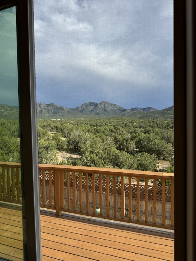 wooden terrace featuring a mountain view