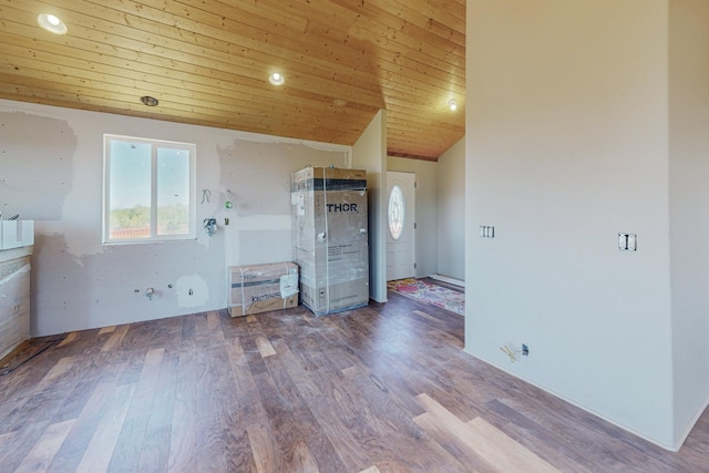 interior space with vaulted ceiling, hardwood / wood-style floors, and wooden ceiling