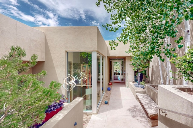 property entrance with a patio