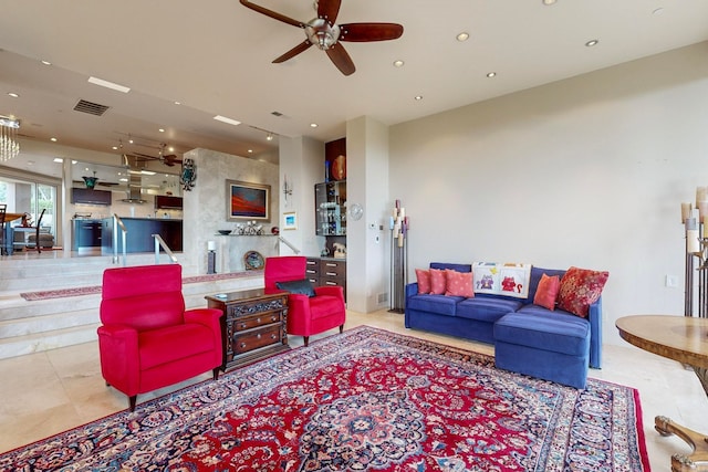 tiled living room featuring ceiling fan