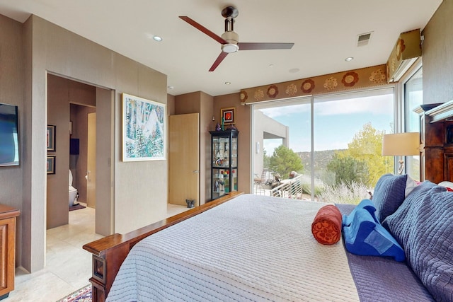 bedroom featuring ceiling fan, ensuite bath, and access to exterior