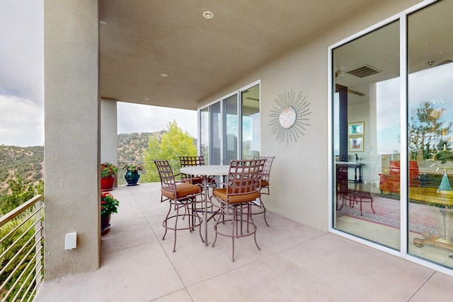 view of patio with a balcony