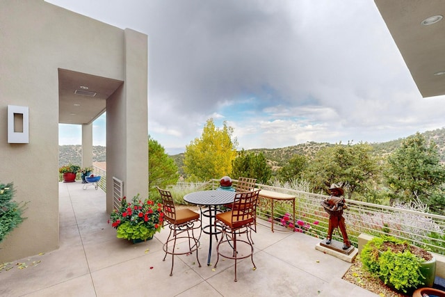 view of patio with a balcony