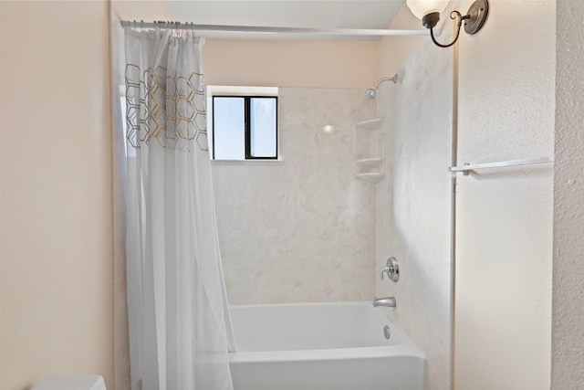 bathroom featuring shower / bath combo with shower curtain