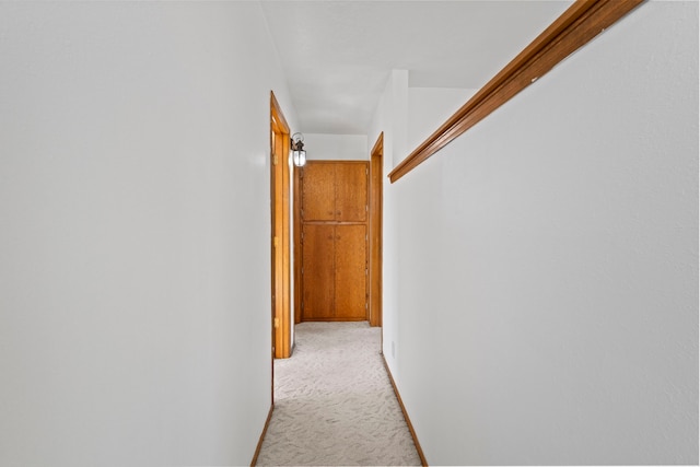 hallway with light carpet