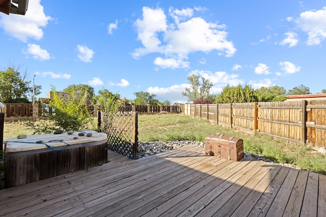 deck with a hot tub