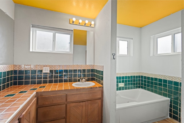 bathroom featuring a tub and vanity