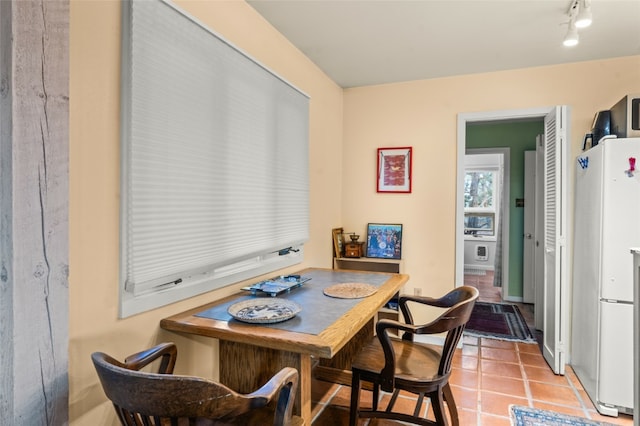 tiled dining space with rail lighting