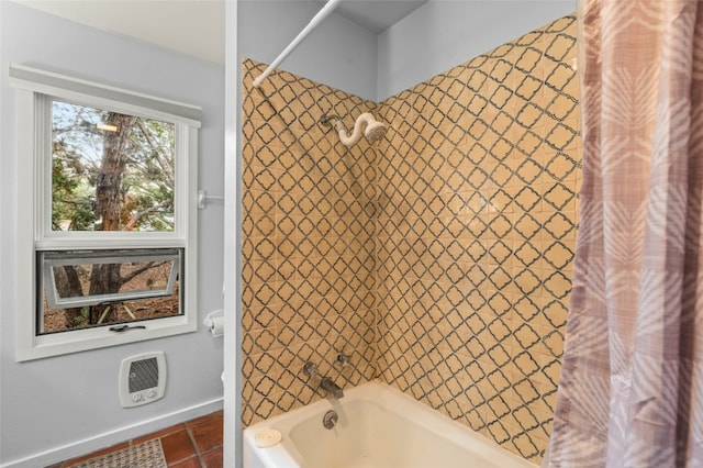 bathroom featuring tile flooring and shower / bath combo with shower curtain