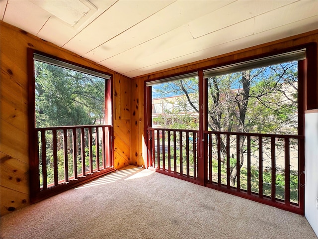 unfurnished sunroom with a wealth of natural light and lofted ceiling