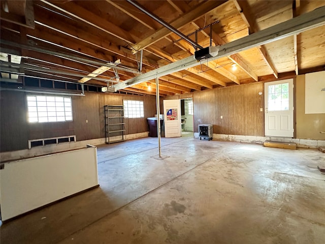 basement featuring wooden walls