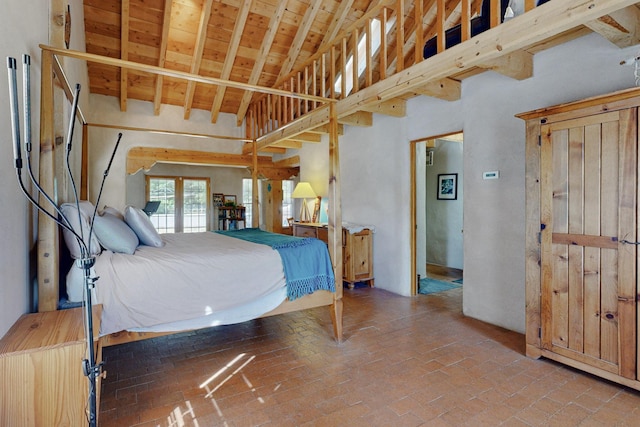 bedroom with beamed ceiling, high vaulted ceiling, and wood ceiling