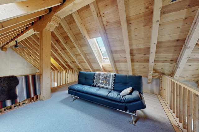 living area featuring lofted ceiling with skylight, wooden walls, carpet floors, and wood ceiling