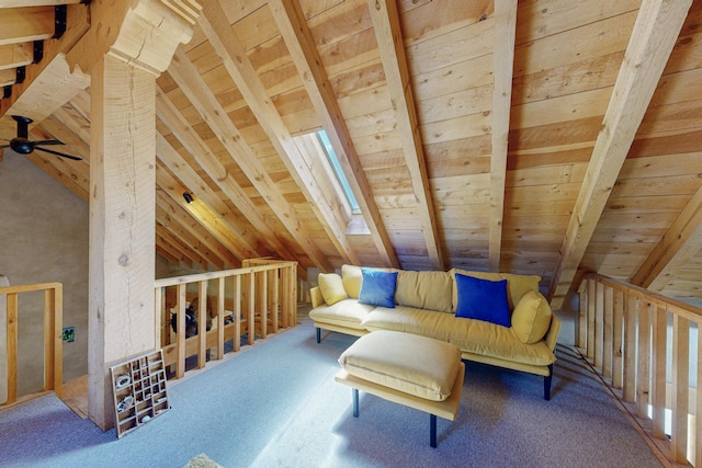 sitting room with carpet, vaulted ceiling with beams, ceiling fan, and wooden ceiling