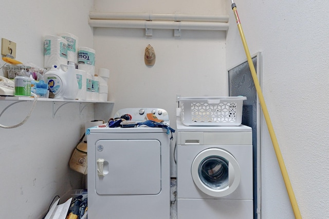 laundry room featuring separate washer and dryer