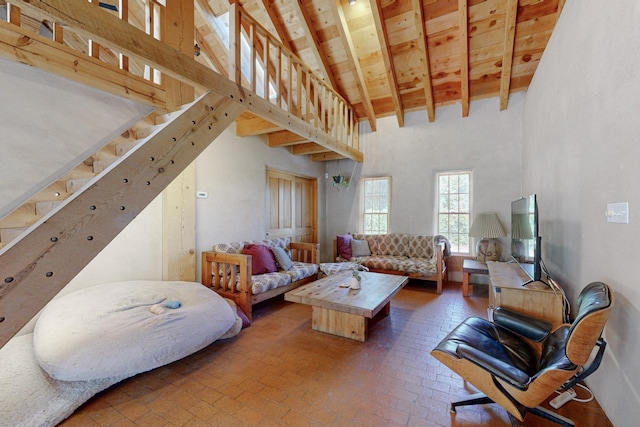 living room with beam ceiling, high vaulted ceiling, and wooden ceiling