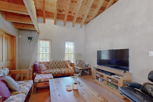 living room featuring beam ceiling, light hardwood / wood-style floors, high vaulted ceiling, and wooden ceiling