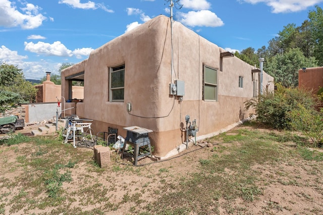 view of property exterior with stucco siding