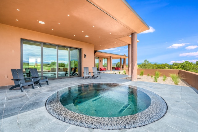 view of swimming pool featuring a patio area