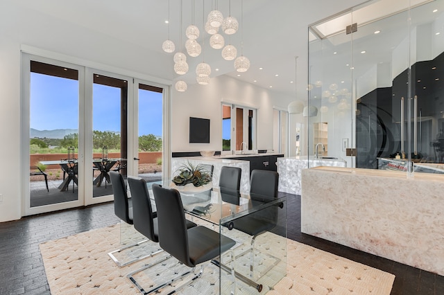 dining area with hardwood / wood-style floors and sink