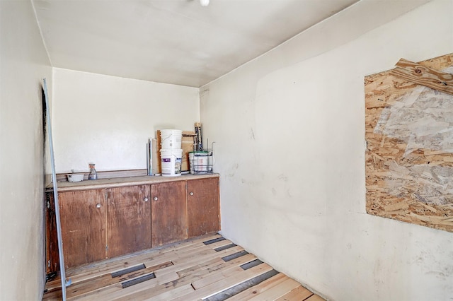 bar featuring light hardwood / wood-style flooring