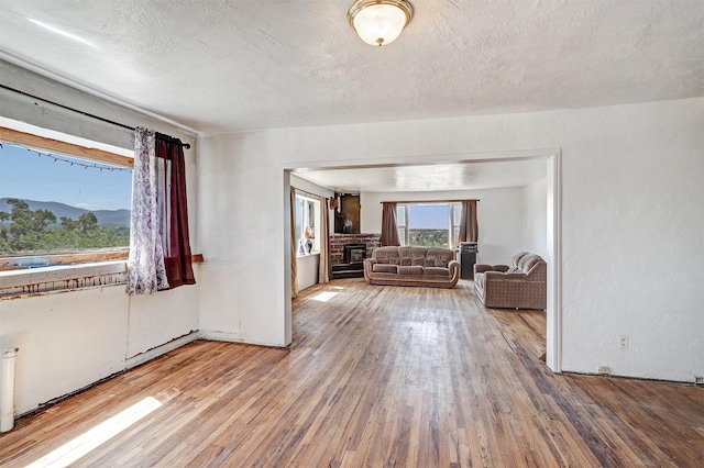 interior space with hardwood / wood-style flooring and a textured ceiling