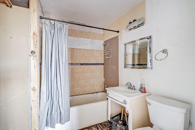 full bathroom with toilet, sink, and shower / bath combo with shower curtain