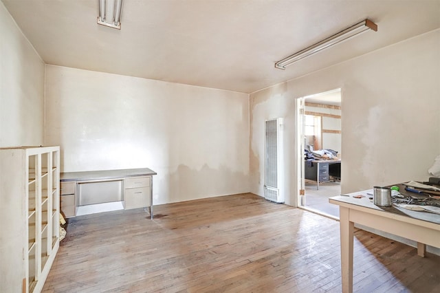 empty room with light hardwood / wood-style floors