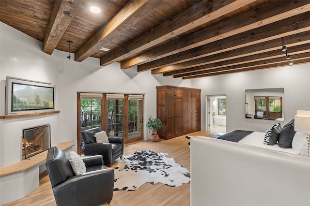 bathroom with wooden ceiling, vanity, a washtub, and beamed ceiling