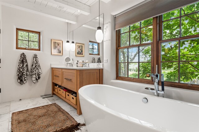 bathroom featuring vanity, a bathing tub, beam ceiling, and wood ceiling