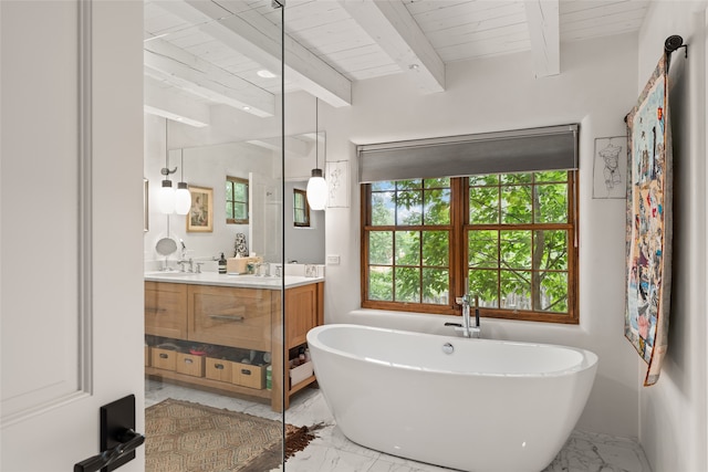 bathroom with beam ceiling, vanity, plus walk in shower, and plenty of natural light