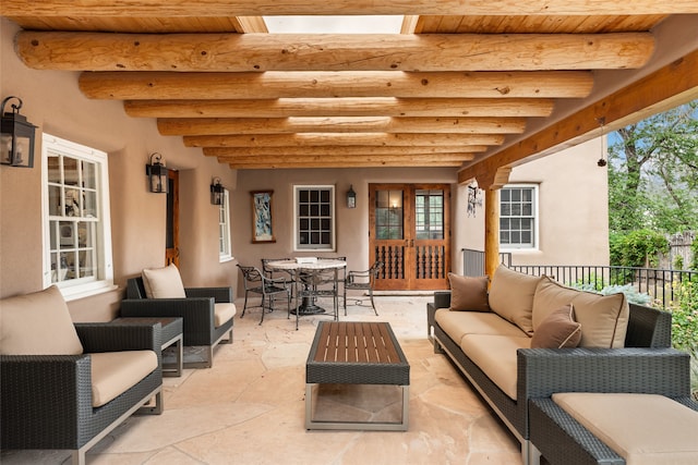 view of patio / terrace with french doors and an outdoor living space