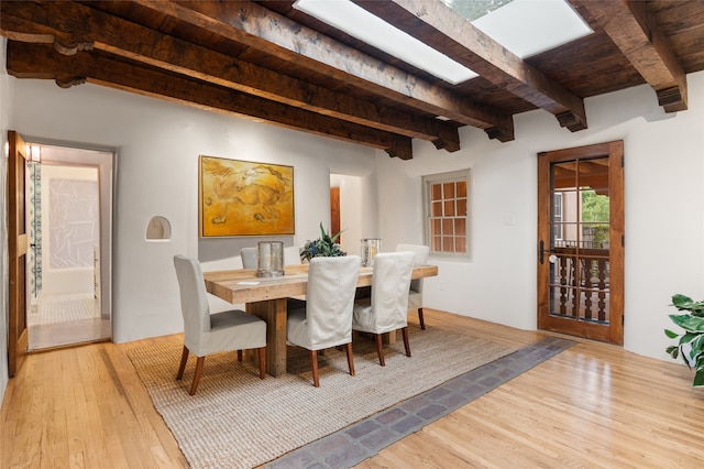 kitchen with ceiling fan, beamed ceiling, sink, dishwasher, and range hood