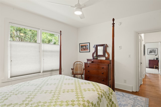 bedroom featuring hardwood / wood-style flooring and ceiling fan