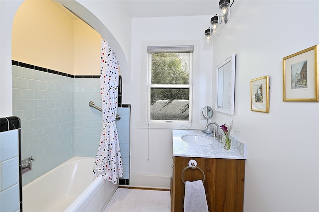 bathroom with shower / bathtub combination with curtain and vanity